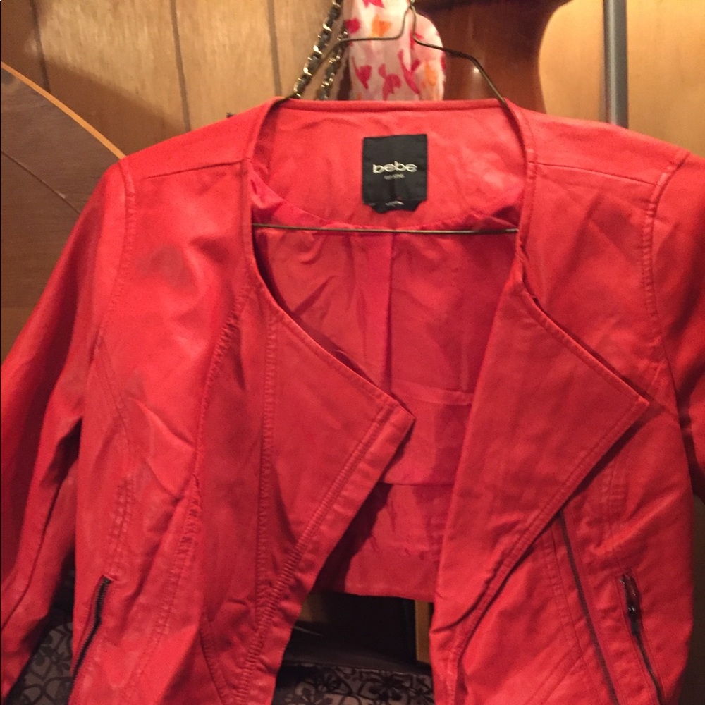 Xs Bebe mid way orange leather jacket